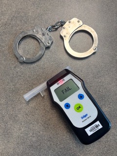 Handcuffs and breathalyzer, FAIL