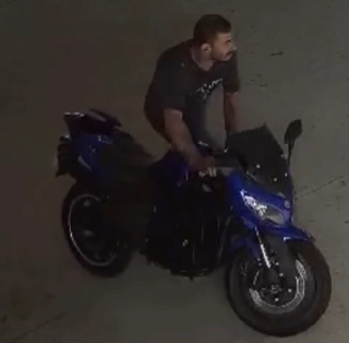 Person on a blue motorcycle