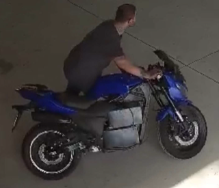 Person on a blue motorcycle
