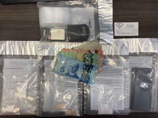 Canadian money and items in clear plastic bags.