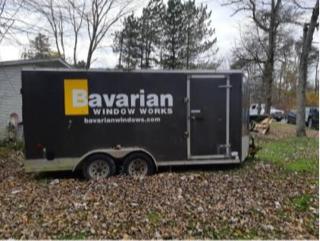 Black trailer with "Bavarian Window Works bavarianwindows.com"