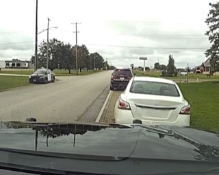 Cars parked along a street.