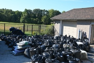 Piles of black trash bags