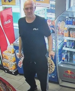 Man in a black t-shirt and black pants