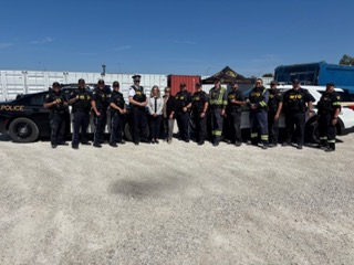 Group of police officers and emergency responders in uniform.