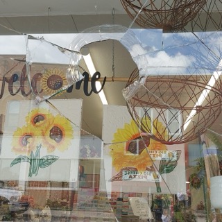 Welcome sign with sunflowers and ribbon
