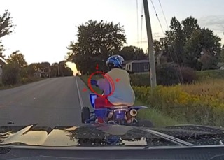 Motorcyclist riding on a wet road