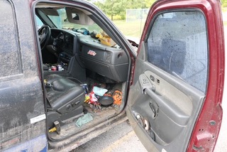 Disorganized truck interior with visible clutter.