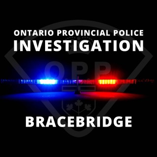 OPP crest over flashing red and blue lights