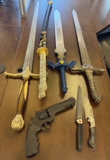 Five swords, a toy gun, and two knives.