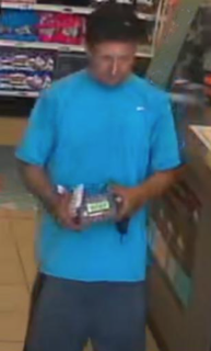 Person holding a packaged snack in a store