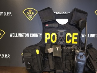 Police tactical vest with gear attachments.