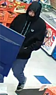 Person in a black hoodie and jeans