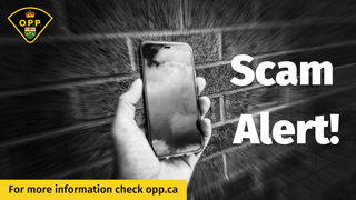 Hand holding a smartphone, Scam Alert, for more information check opp.ca