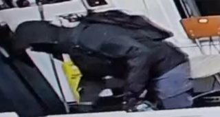 Person wearing a black jacket and jeans