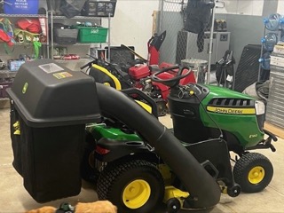 John Deere riding lawn mower with grass catcher