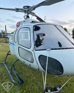 Helicopter front view, pilot visible