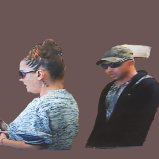 Two people, side by side, appear pixelated.