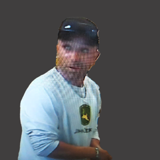 Person wearing a white long-sleeve shirt and black hat