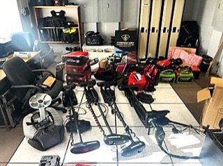 Several metal detectors on a tiled floor.