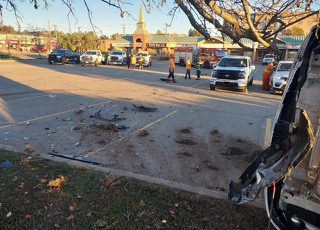 Vehicle collision with debris in street, emergency responders present