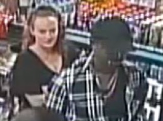 Person smiling in a store aisle