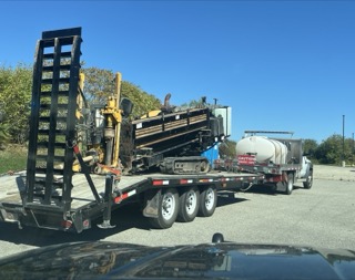 Tractor trailer hauling drilling equipment