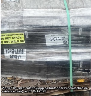 Battery labeled "Nonspillable" secured with green tape