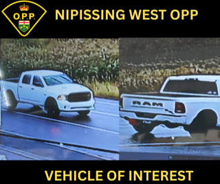 White pickup truck on snow-covered road