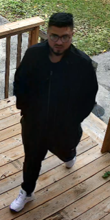 Man in black athletic wear and glasses