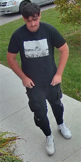 Person in black t-shirt and cargo pants