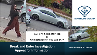 White car parked on a residential street.