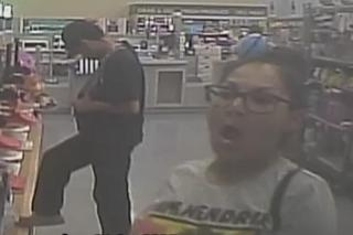 Two people in a store, image is blurry