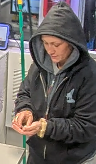 Person examining small pills in their hand