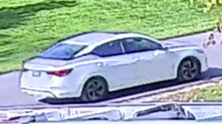 White sedan on a road