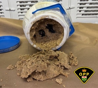 Powder spills from an overturned plastic container