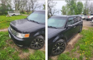 Black Ford Escape on grass