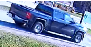 Black pickup truck on a driveway