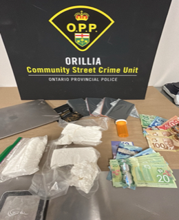 Drugs and Canadian currency on a table.