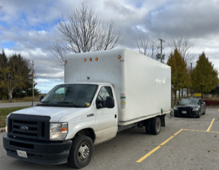 White cargo van parked in a lot