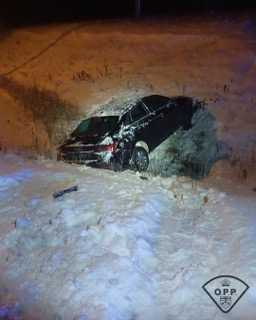 Car stuck in snow, visible damage