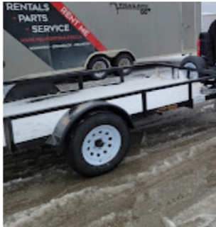 Utility trailer with black and white exterior.