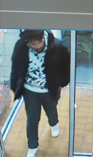 Person wearing a black hoodie and dark pants