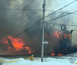 Large wildfire with heavy smoke.