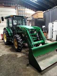 Green tractor with a front-end loader, John Deere