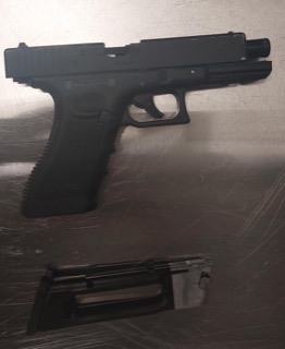 Black handgun and magazine