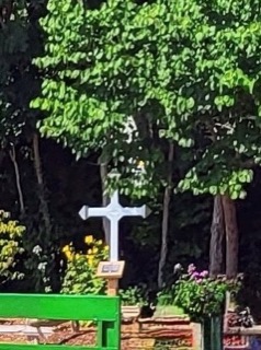 White cross in a garden