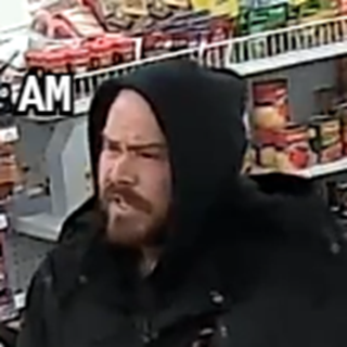 Man in a black hoodie.