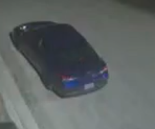 Dark blue car, angled view