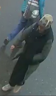 Person wearing a black shirt and pants, white shoes